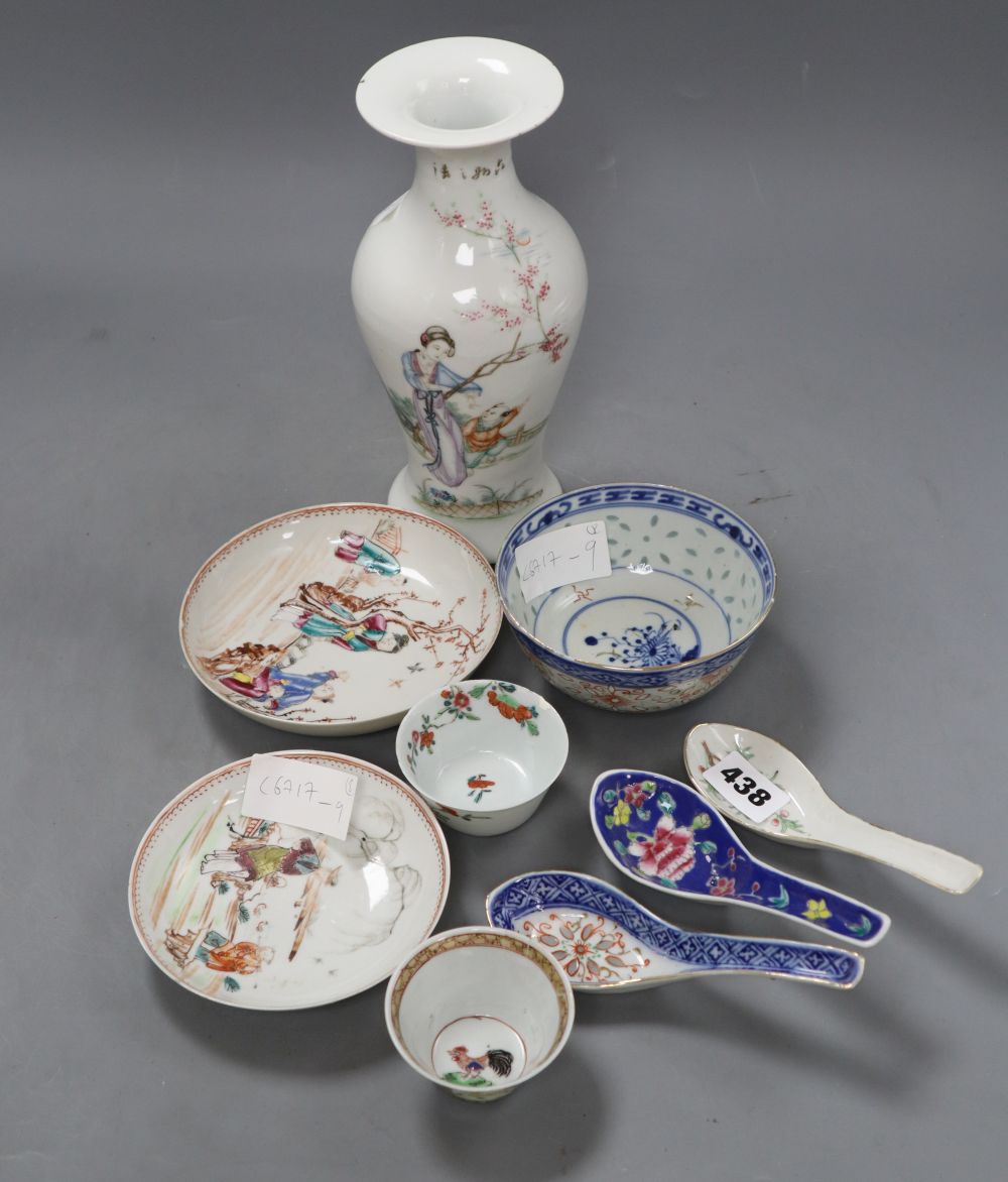 Two 18th century Chinese famille rose tea bowls and two saucers, together with three rice spoons and a bowl